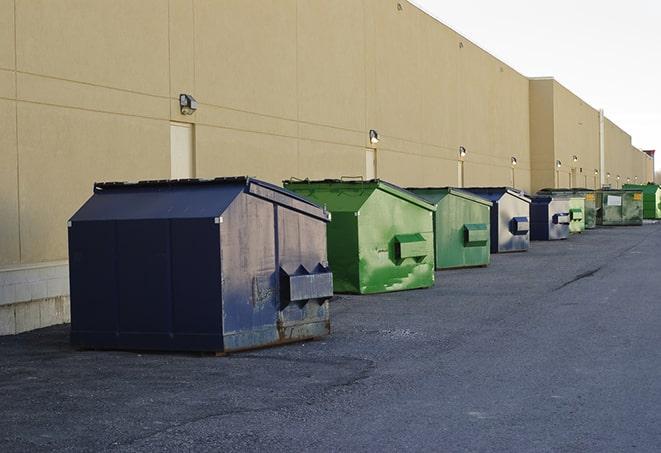 a fleet of red and blue construction dumpsters available for use in Miamisburg, OH